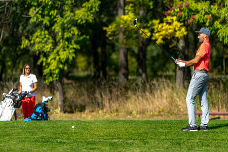 Couple on a golfing vacation, beautiful sunny weatherの写真素材