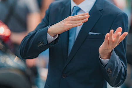 Businessman talking, gesturing with hands