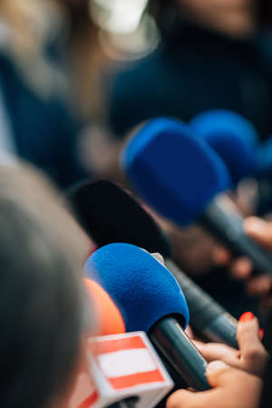 News reporters interviewing a politician.