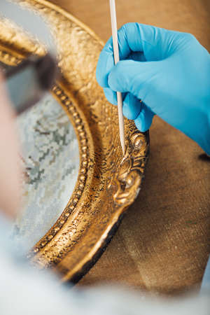 Ornate gold-plated picture frame restorationの写真素材