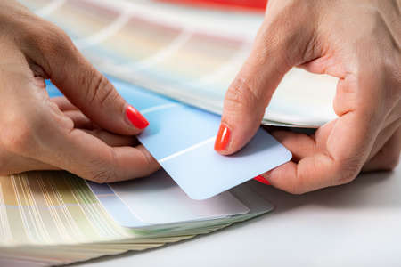 Interior designer choosing colors from color palette for walls.の写真素材