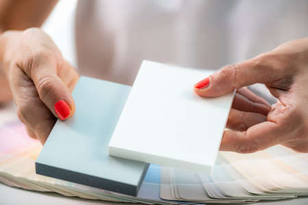 Designer holding compact board samples