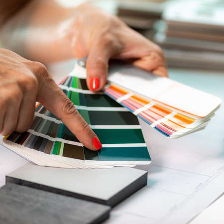 Interior designer matching color samples. Choosing compact boards and color palette material samplesの写真素材