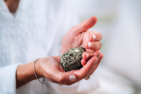 Prosperity in life concept. Spiritual coach holding a natural object of value, helping people...