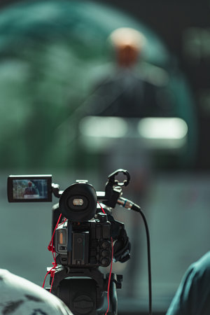 Cameraman recording at media press conference. Live streaming concept.