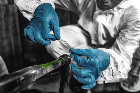 Police Forensic Science Investigator Lifting Fingerprints from a Crime Sceneの写真素材