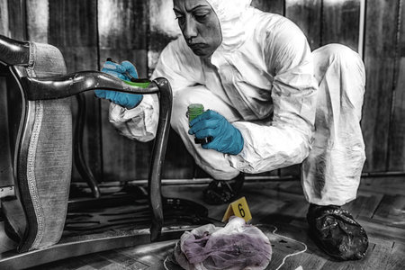 Forensic Science. Police investigator looking for fingerprints.の写真素材