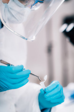 Bioarcheology. Archaeologist analyzing human skull in DNA archaeology lab.の写真素材