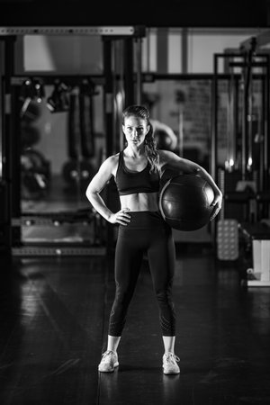 Female athlete exercising with Wall Ball.の写真素材