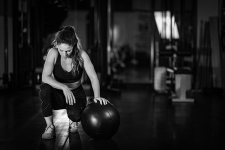 Female athlete exercising with Wall Ball.の写真素材