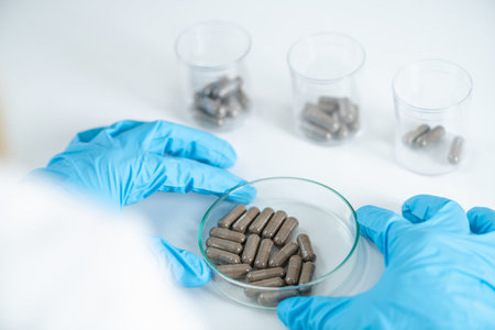 Fecal transplant caps in the lab petri dish. Explore groundbreaking research aiming to harness the potential of the microbiome for innovative therapeutic treatments and improved gastrointestinal healthの素材 [FY310208220048]