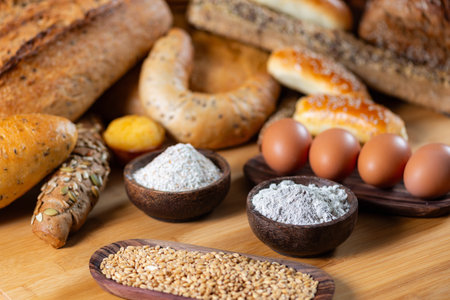 Close-up of integral flour and rye grains in wooden bowls.の写真素材