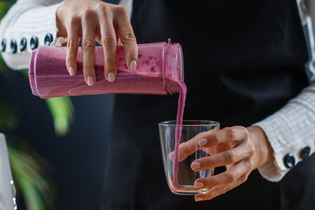 Creating a wholesome and nutritious shake in a blender, combining superfoods for a boost of health...