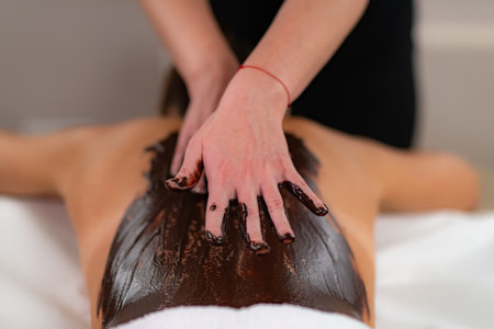 Pure luxury with a beauty treatment featuring a rich cocoa paste, as indulgent chocolate body massage and rejuvenatesの写真素材