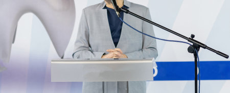 Captivating the audience with insightful knowledge, a female speaker delivers empowering talks on stageの写真素材
