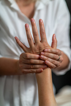 Hand massage for women helps relieve tension, improve circulation, reduce stress, and promote relaxation. It also removes dead skin cells, unclogs pores, and enhances smoother, healthier skinの写真素材
