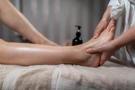 Lymphatic drainage massage, specialized therapeutic technique designed to stimulate the lymphatic system, encouraging the movement of lymph fluid, helps remove toxins, reduce swelling, and boost the immune system.の写真素材