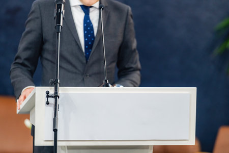 Articulating key points at a media press conference informs journalists effectively. The speakerâs clear delivery fosters public understanding and confidence with transparent communication.の写真素材