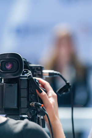 Camera at press conference captures vital updates, supporting reliable journalism. Its clear footage...
