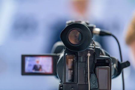 Camera at press conference captures critical statements, ensuring reliable media output. Its steady...