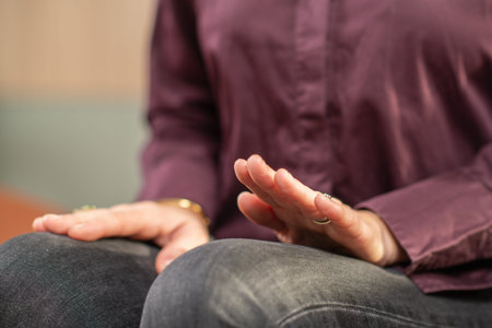 Woman performing self-guided tapping using legs to calm the nervous system. Highlights controlled...
