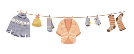 Knitted clothes on rope. Knit, wool thread cardigan and sweater. Knitting accessories, mittens and warm socks vector banner. Illustration of textile clothes, cotton clothing knitのイラスト素材