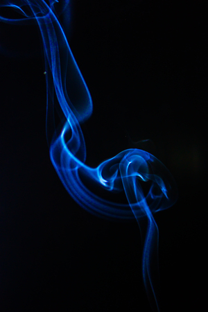 Blue smoke on black backgroundの写真素材