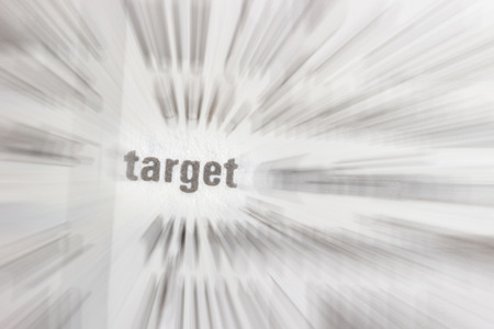 Black text on white background. Focus "target" and radial blur text on white paper backgroundの写真素材