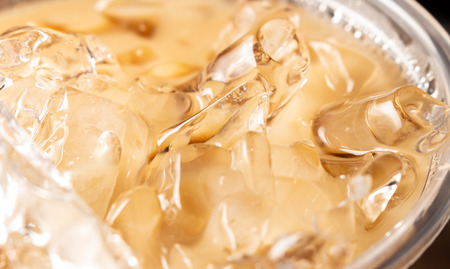 Back focus ice coffee in glassの写真素材