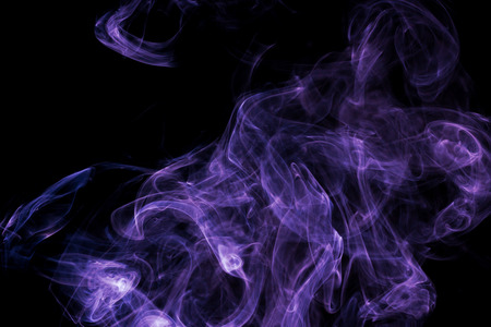 Purple smoke on black backgroundの写真素材