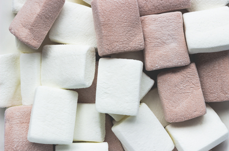 Top view of white and brown marshmallowsの写真素材