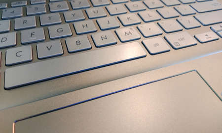 Close up gold keyboard and touch pad of laptop