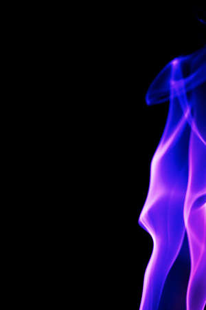Abstract purple smoke on black backgroundの写真素材