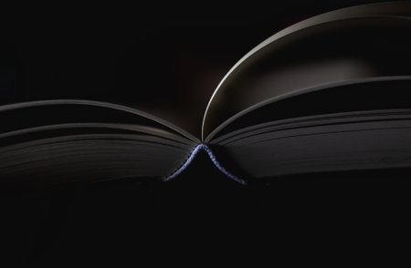 Close up book on table and dark background