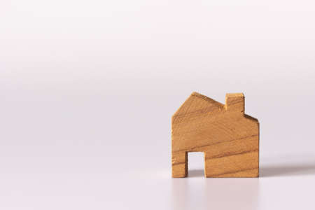 Small wooden house on white background and copy spaceの写真素材