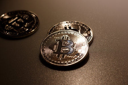 Close up bitcoins on table and reflection of lightの写真素材