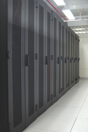 An row of racks in a commercial data center securely housing computers and servers