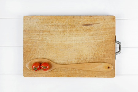 top view spoon tomatoes on wooden backgroundの写真素材