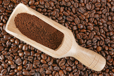top view closeup coffee beans wood scoop の写真素材