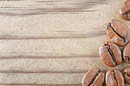 close up macro top view coffee beans on wood backgroundの写真素材