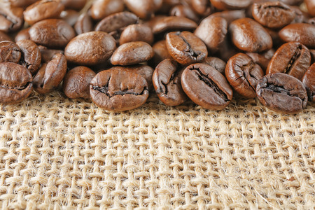 closeup macro coffee beans on juta backgroundの写真素材