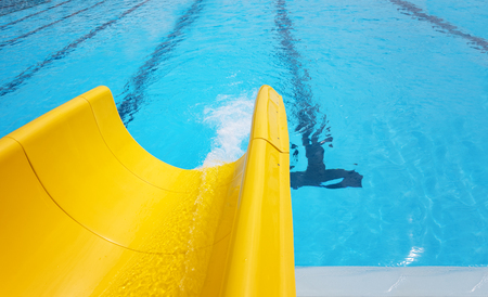 Detail of yellow slide chute in the poolの写真素材