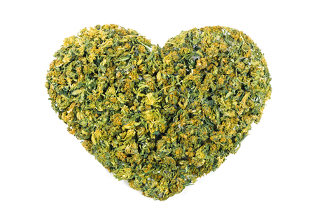 Marijuana flowers in the shape of heart isolated on white backgroundの写真素材