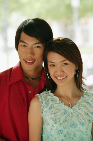 Couple looking at camera, smilingの写真素材