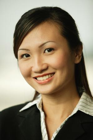 Young woman smiling looking at cameraの写真素材