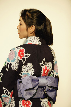 Young woman in kimono, rear viewの写真素材