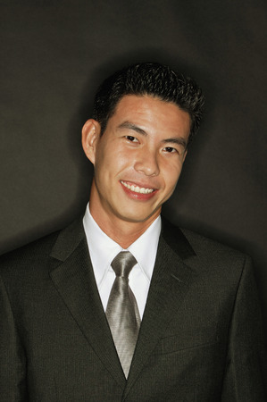 Young man smiling, portraitの写真素材