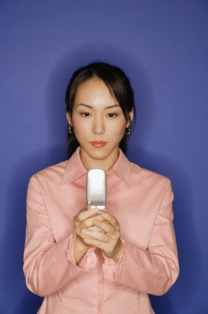 Young woman, using mobile phoneの写真素材