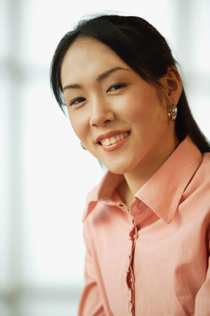 Young woman, looking at cameraの写真素材