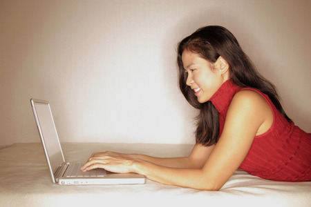 Woman using laptop, profileの写真素材